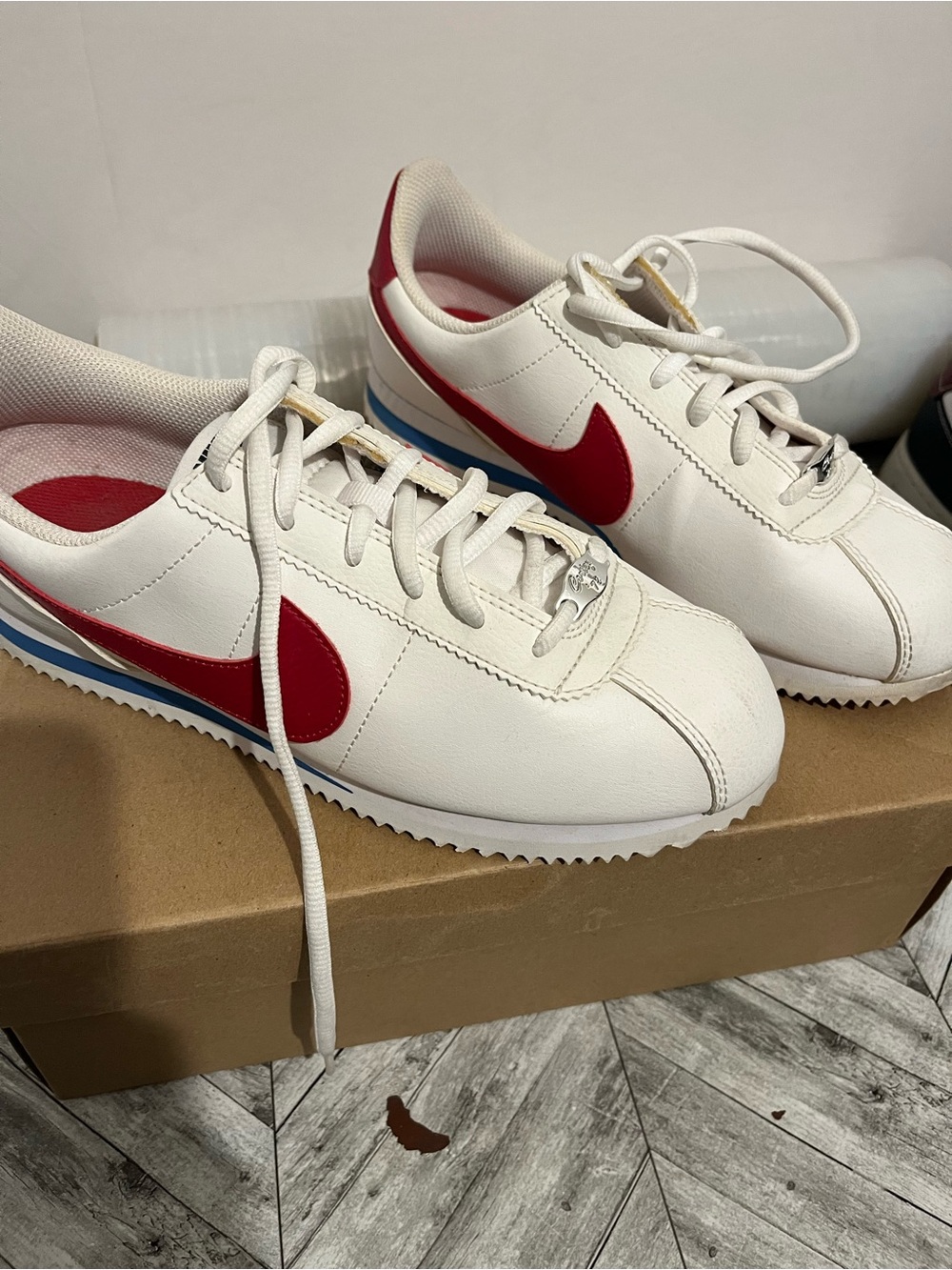 Nike White Cortez Sneakers with Red Swoosh and Blue Accent